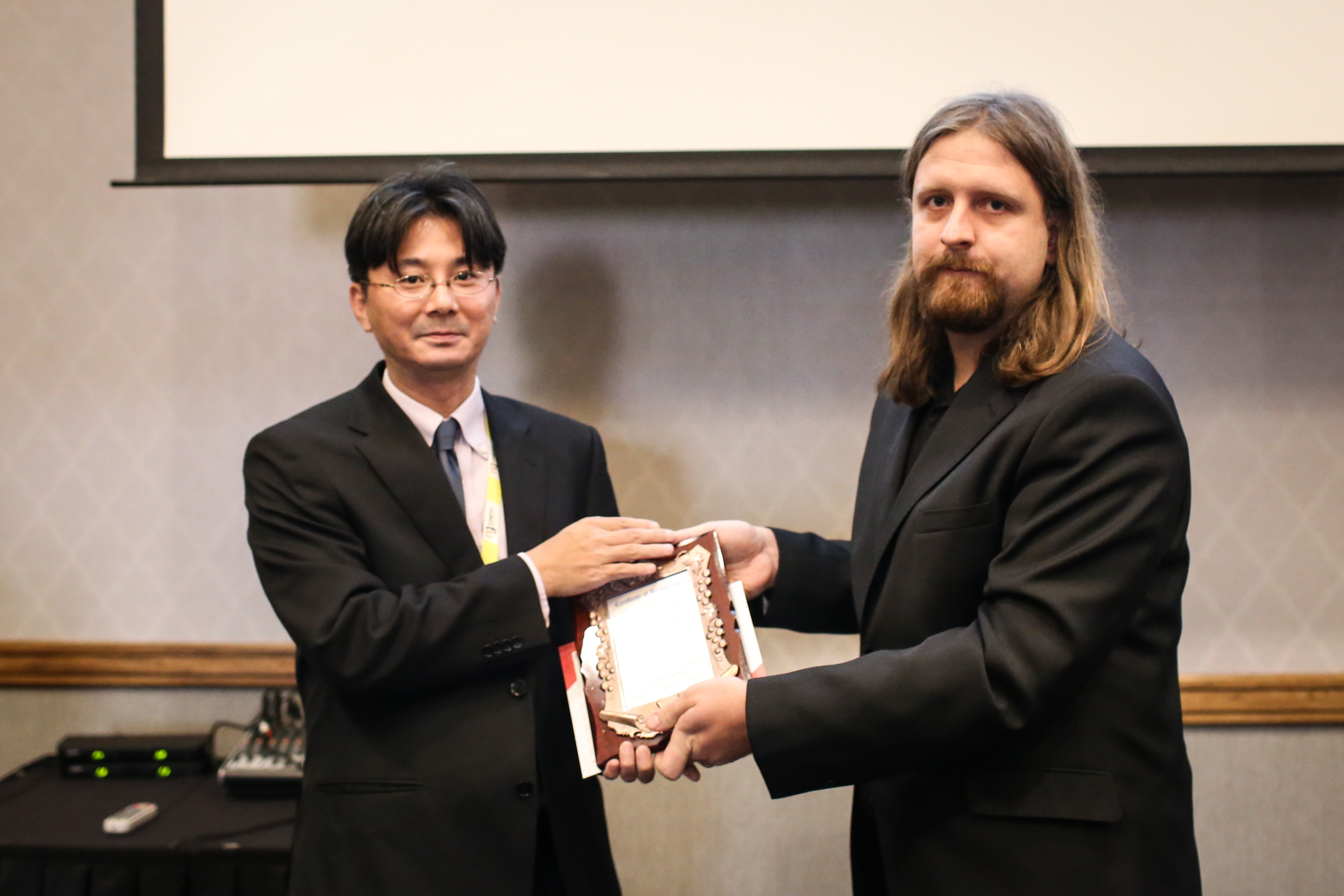Kenichi Komura felicitated by Jiri Tuma